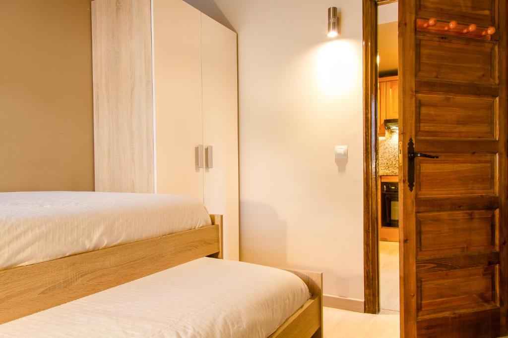 Ліжко або ліжка в номері Apartamento Refugi d'Incles 6 personas
