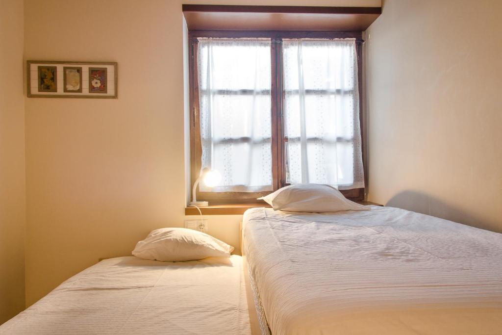 Ліжко або ліжка в номері Apartamento Refugi d'Incles 6 personas