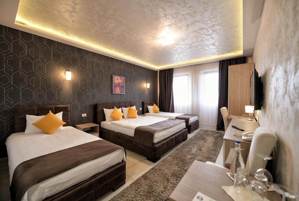 Postel nebo postele na pokoji v ubytování Garnet Hotel & Event Centar