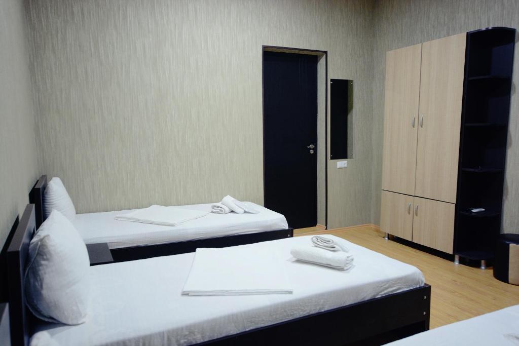Postel nebo postele na pokoji v ubytování Chveni sakhli