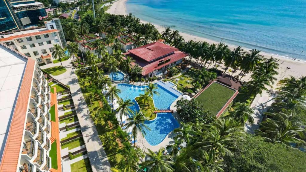 an overhead view of a resort with a pool and the beach at Sanya South China Hotel in Sanya