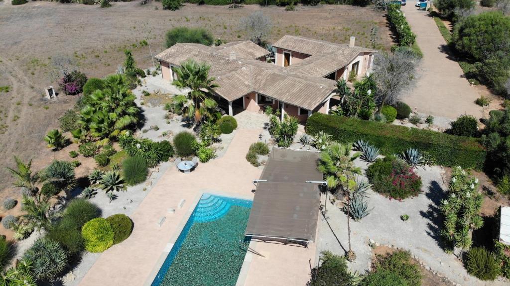 an aerial view of a house with a swimming pool at Finca Casa Mas in Santanyi