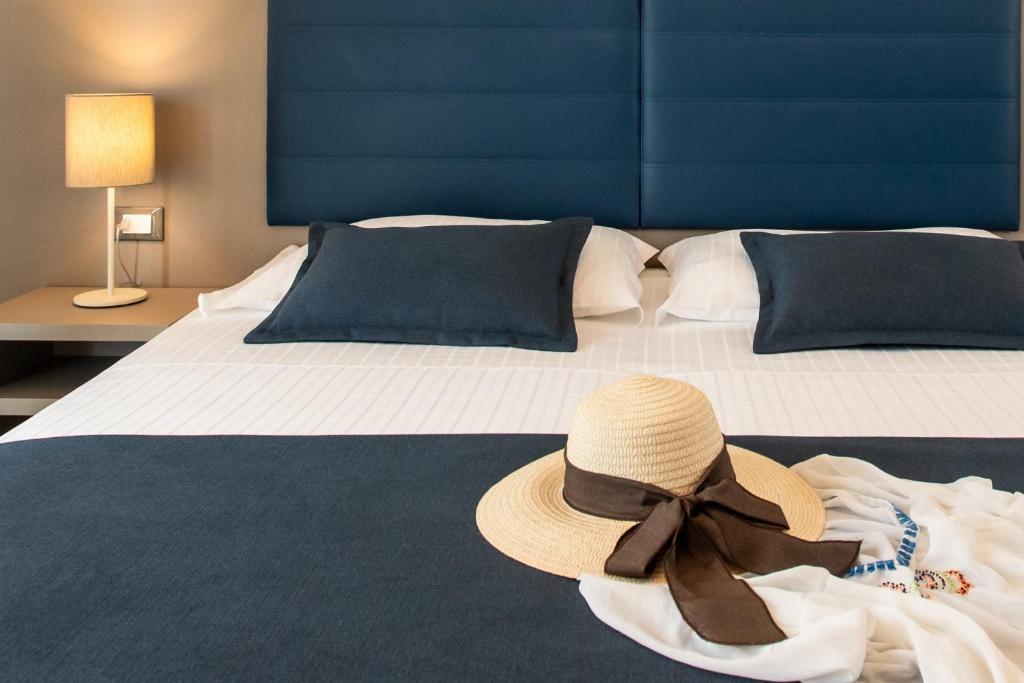 Postel nebo postele na pokoji v ubytování Hotel Delle Mimose
