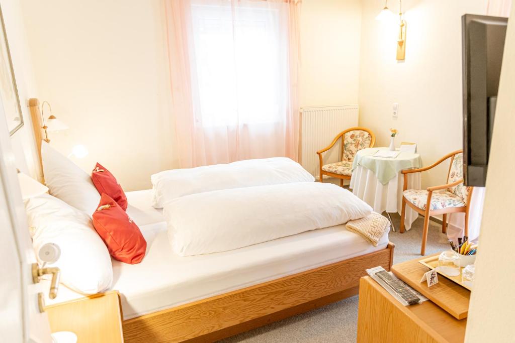Postel nebo postele na pokoji v ubytování Hotel Der Seehof