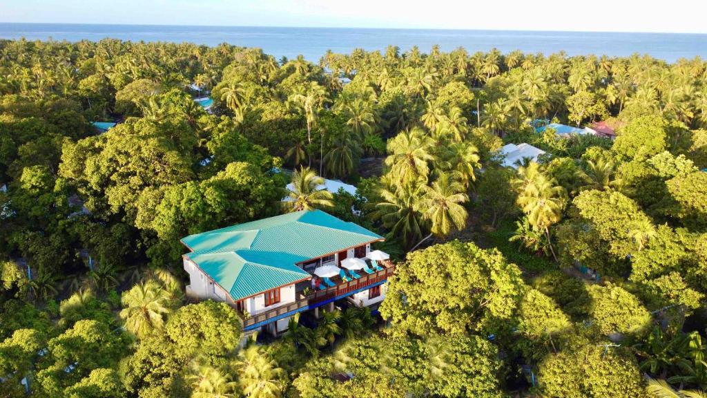 an aerial view of a resort in the forest at Zero Degree Residence in Fuvahmulah