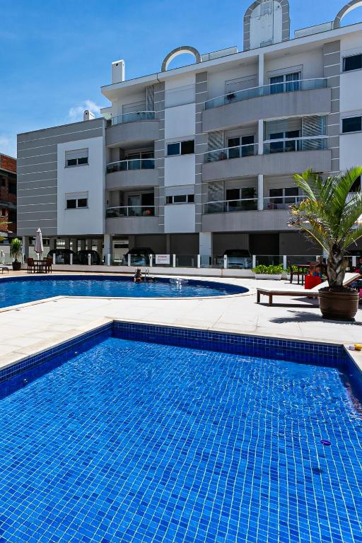  Apto novo em prédio c/ piscina nos Ingleses RTG208