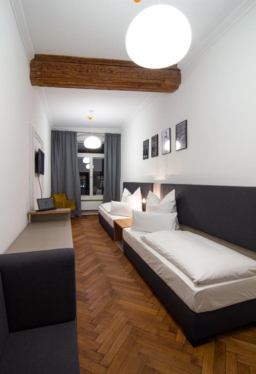 Postel nebo postele na pokoji v ubytování Le Baldinger Boutique Hotel