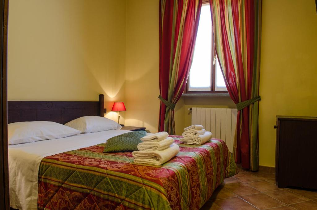 Postel nebo postele na pokoji v ubytování Hotel Oberje Dla Viere