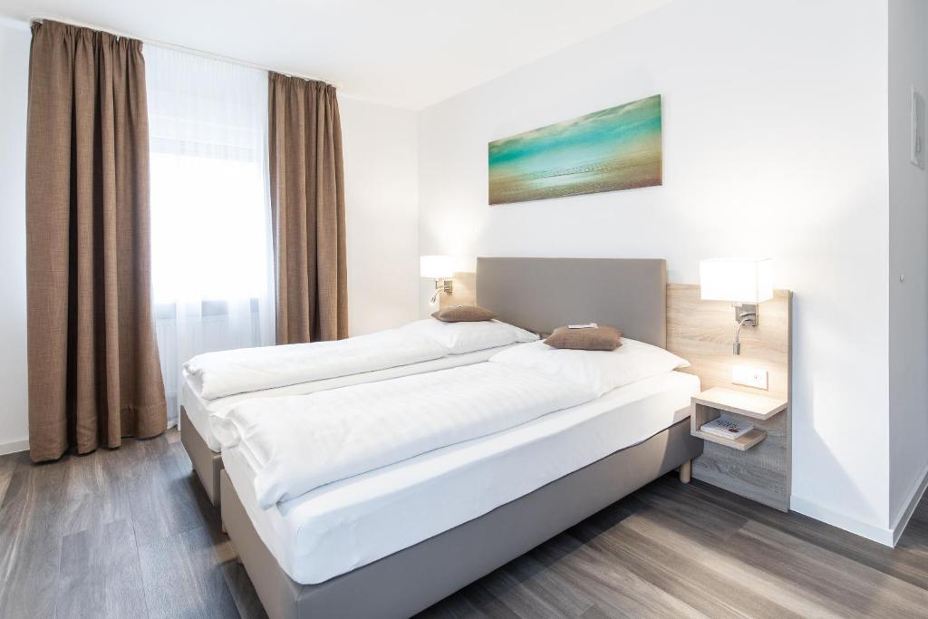Tempat tidur dalam kamar di Köln 2020