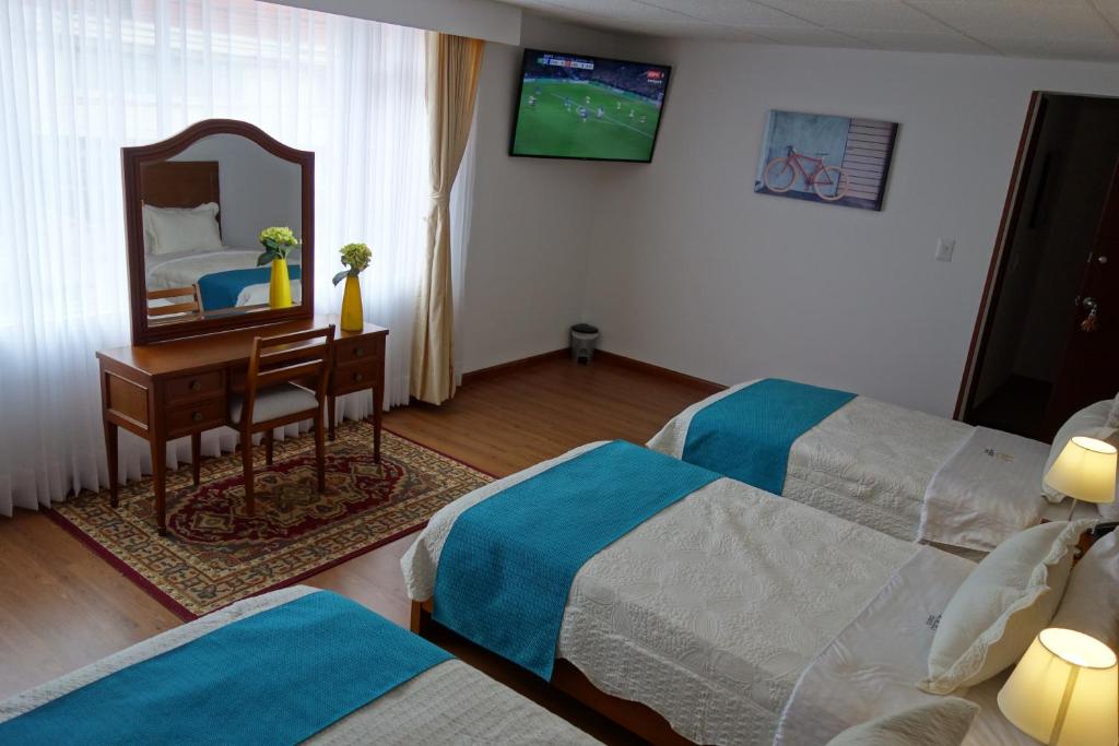 TV a/nebo společenská místnost v ubytování Hotel Maceo Chico
