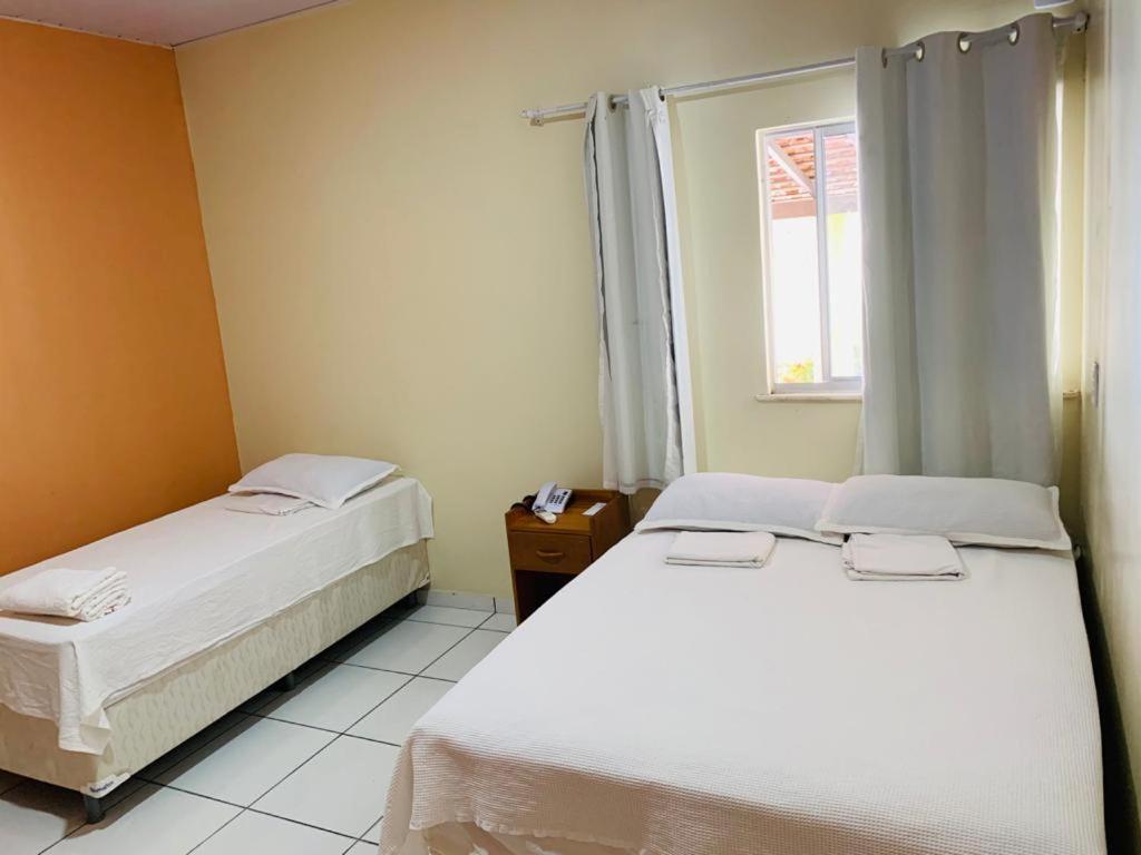 Säng eller sängar i ett rum på Pousada Luz - Santo Amaro do Maranhão