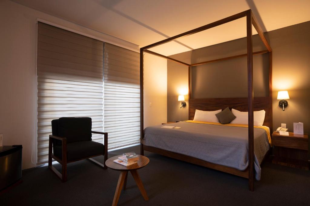 Postel nebo postele na pokoji v ubytování Hotel Boutique Abad