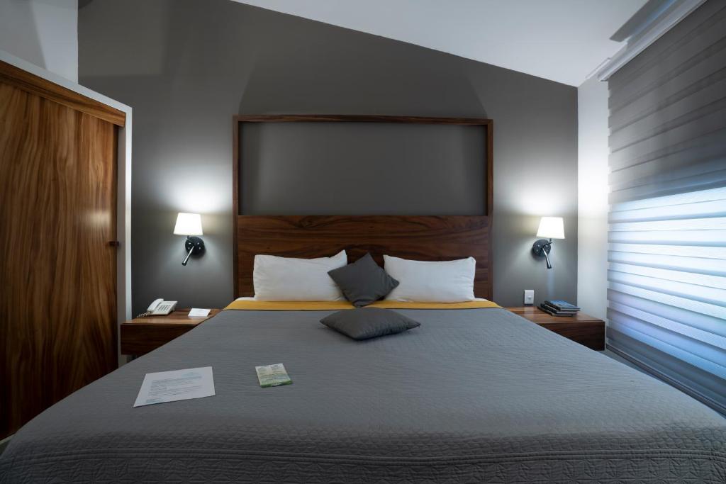 Postel nebo postele na pokoji v ubytování Hotel Boutique Abad