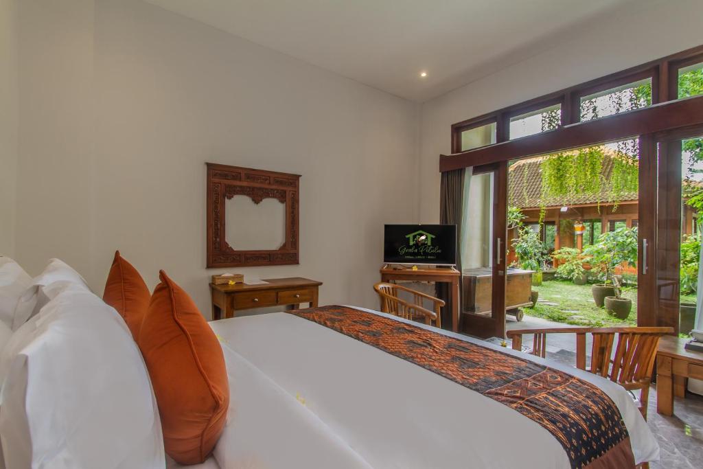 TV a/nebo společenská místnost v ubytování Graha Petulu Ubud by Pramana Villas