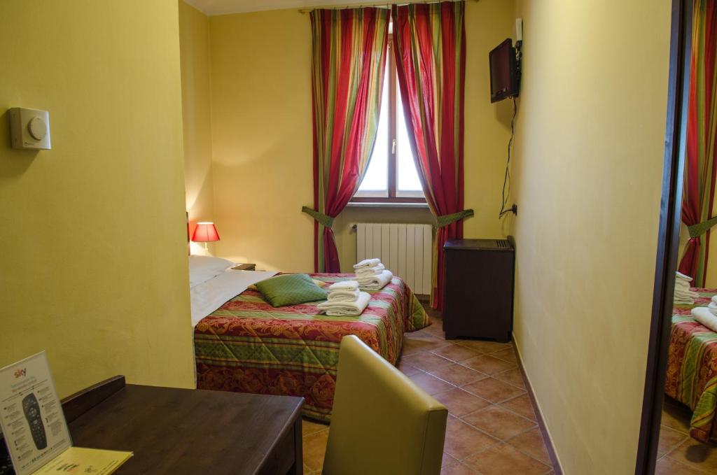 Postel nebo postele na pokoji v ubytování Hotel Oberje Dla Viere