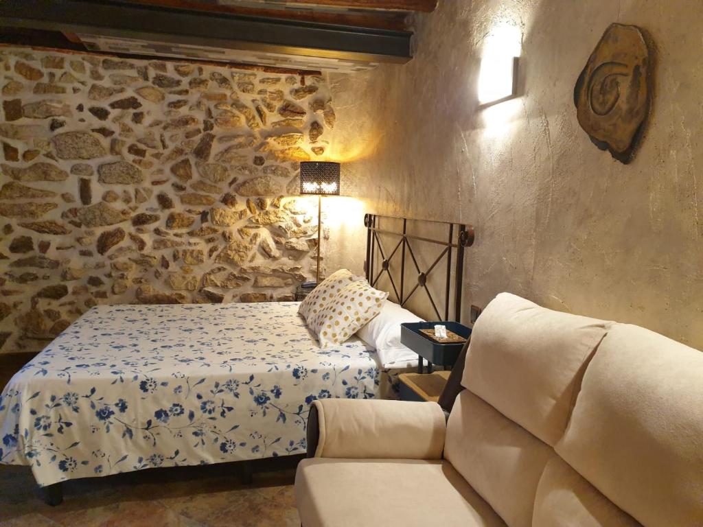 Postel nebo postele na pokoji v ubytování Hotel La Beltraneja
