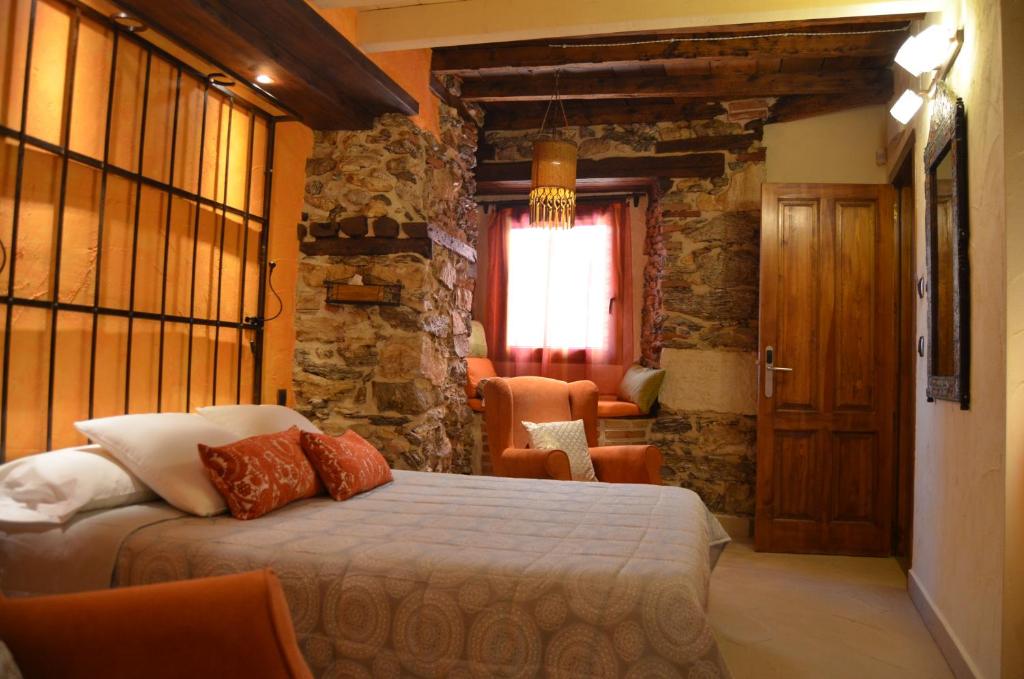 Postel nebo postele na pokoji v ubytování Hotel La Beltraneja