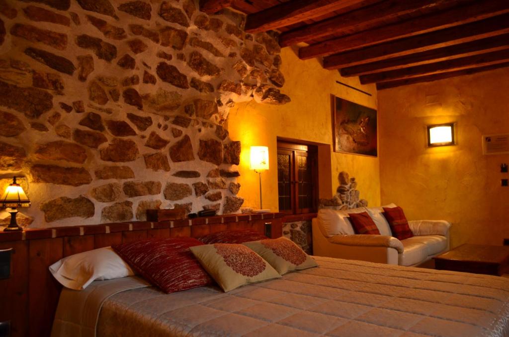 Cama o camas de una habitación en Hotel La Beltraneja
