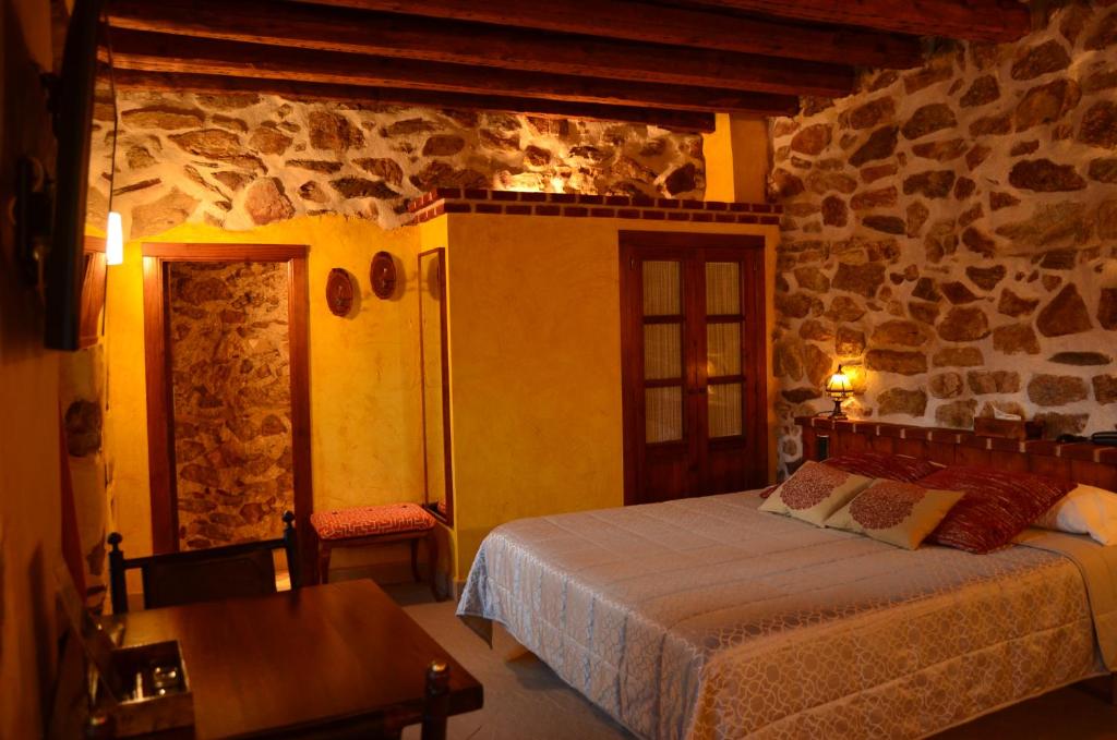 Postel nebo postele na pokoji v ubytování Hotel La Beltraneja