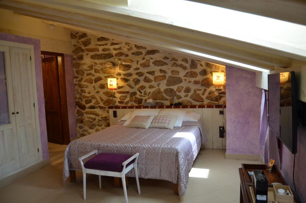Postel nebo postele na pokoji v ubytování Hotel La Beltraneja