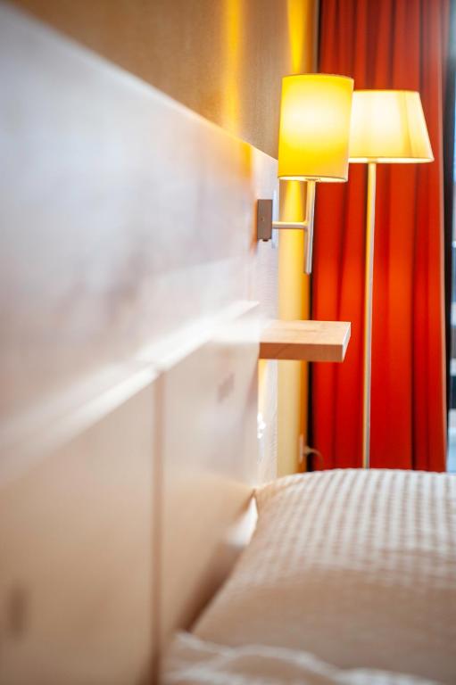 Postel nebo postele na pokoji v ubytování Hotel Gädi