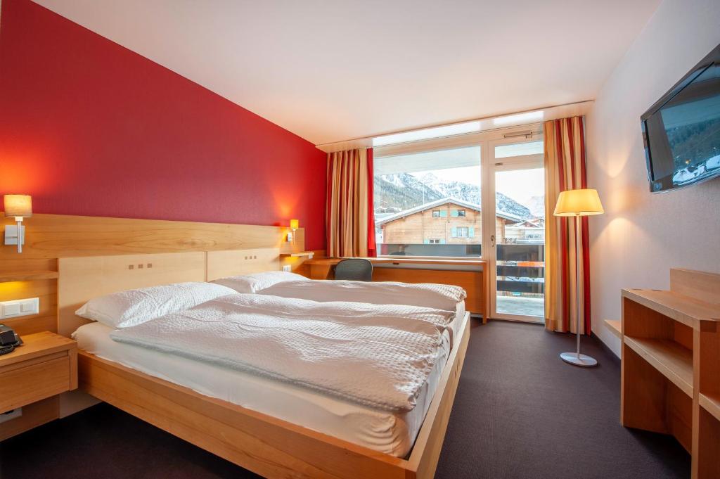 Postel nebo postele na pokoji v ubytování Hotel Gädi