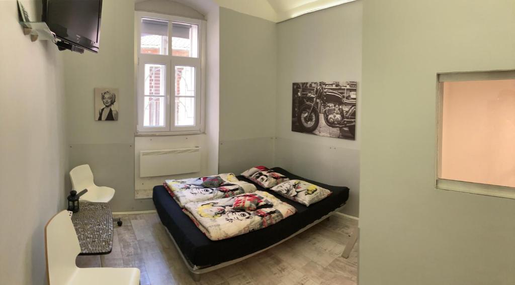 Postel nebo postele na pokoji v ubytování Marilyn City Center