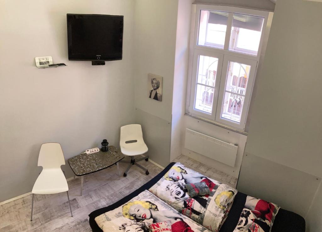 TV a/nebo společenská místnost v ubytování Marilyn City Center