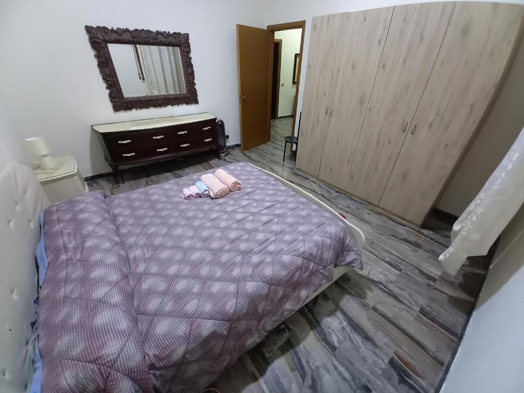 Łóżko lub łóżka w pokoju w obiekcie Bella Reggio