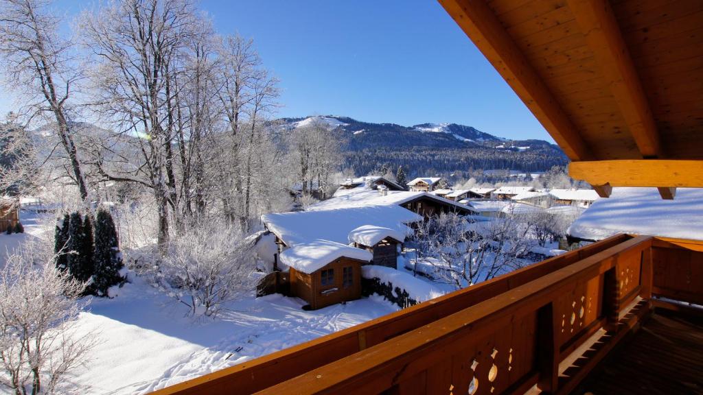 a winter view from the balcony of a cabin at Landhaus Kaiserbach in Ellmau