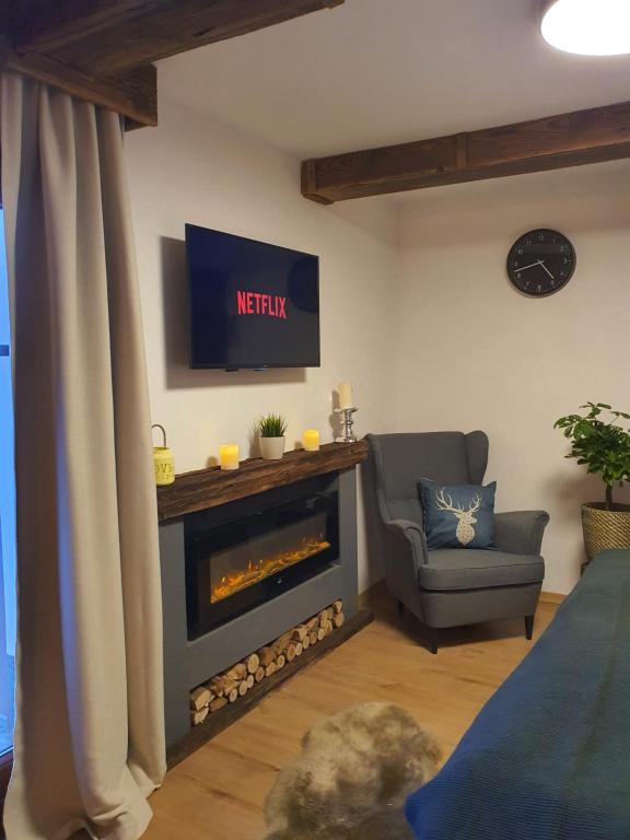 TV in/ali zabaviščno središče v nastanitvi Kozma Apartment Gerlitzen