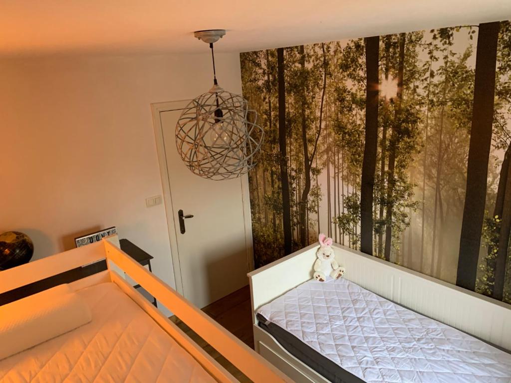 Postel nebo postele na pokoji v ubytování Étoile de Laforêt