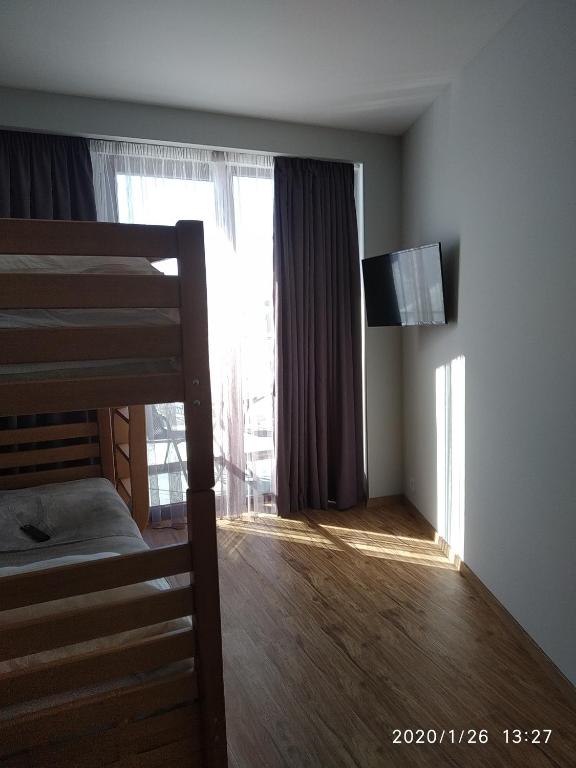 Postel nebo postele na pokoji v ubytování neu gudauri loft2 с видом на горы