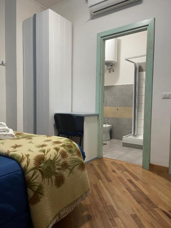 A bed or beds in a room at Affittacamere Le Ginestre