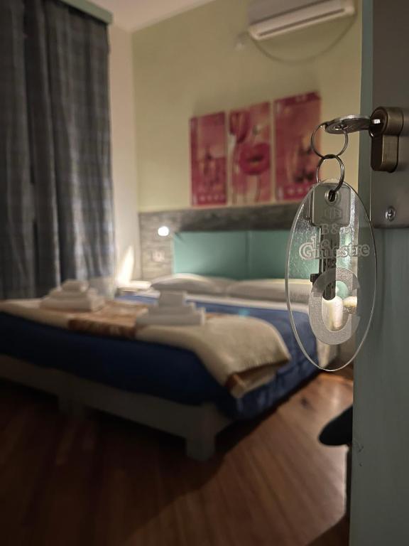 A bed or beds in a room at Affittacamere Le Ginestre