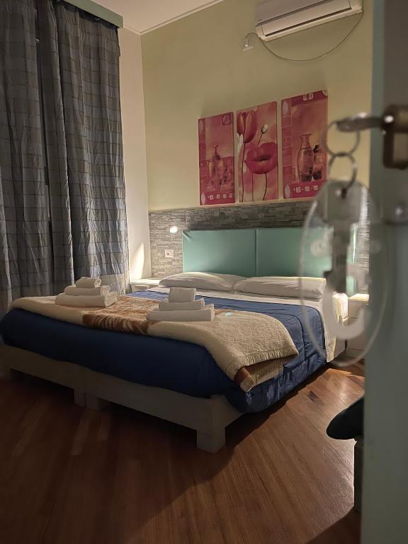 A bed or beds in a room at Affittacamere Le Ginestre