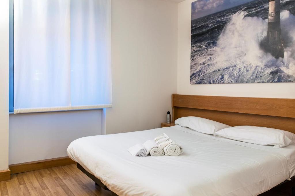 Posteľ alebo postele v izbe v ubytovaní Residence Portello