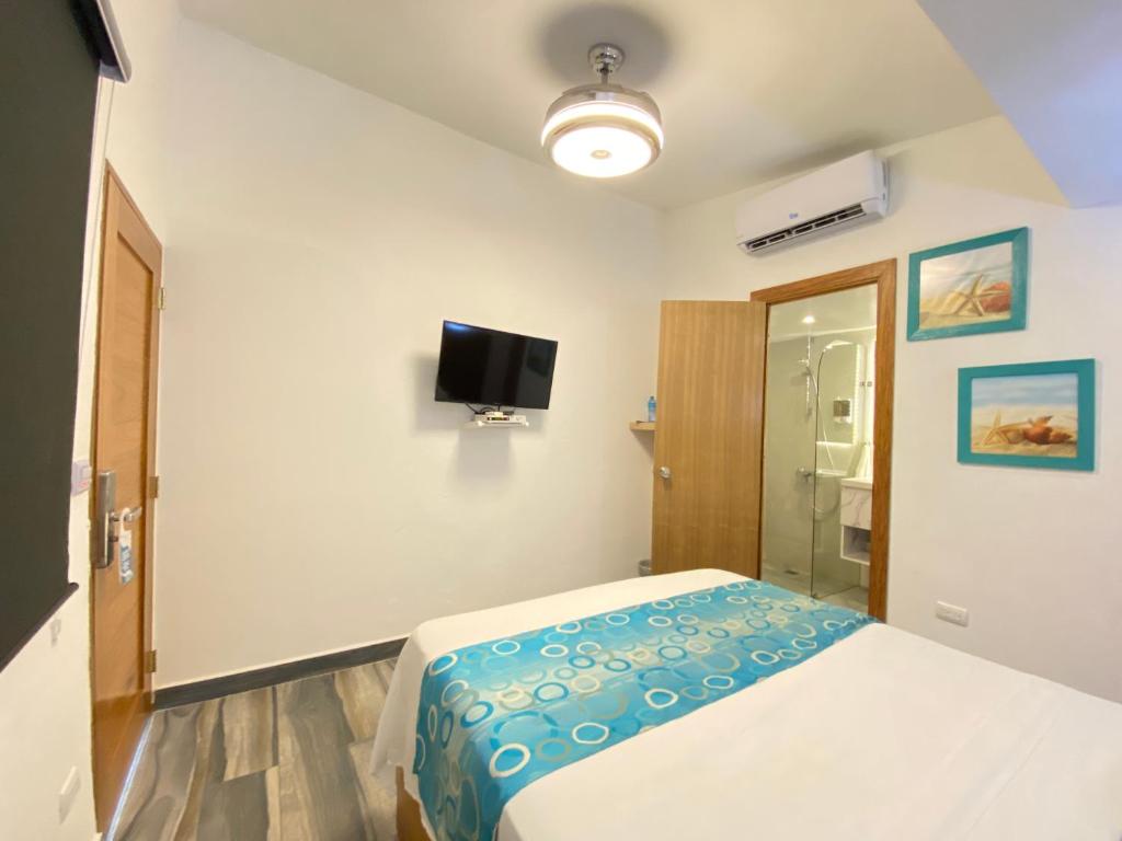 Postel nebo postele na pokoji v ubytování Hotel Agua Dulce