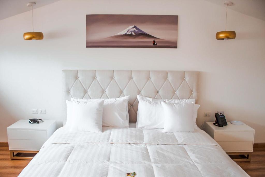 Postel nebo postele na pokoji v ubytování Adamas House Hotel Boutique