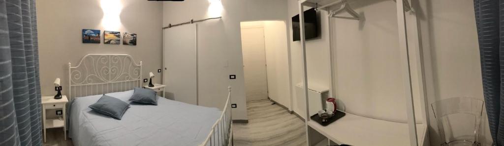 Posteľ alebo postele v izbe v ubytovaní ATTICO LIVORNO Bed & Relax