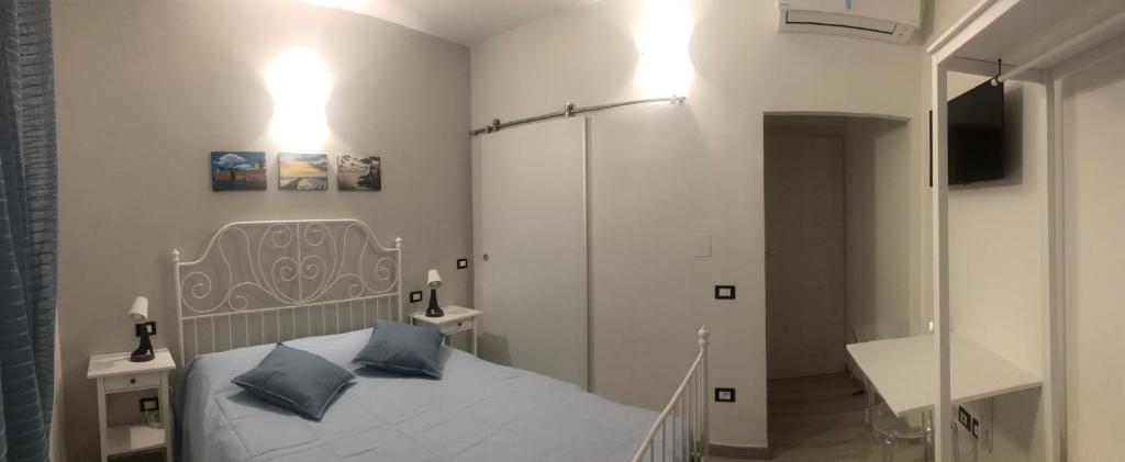Posteľ alebo postele v izbe v ubytovaní ATTICO LIVORNO Bed & Relax