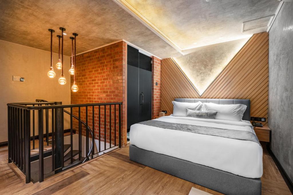 Postel nebo postele na pokoji v ubytování A&R Urban Hotel
