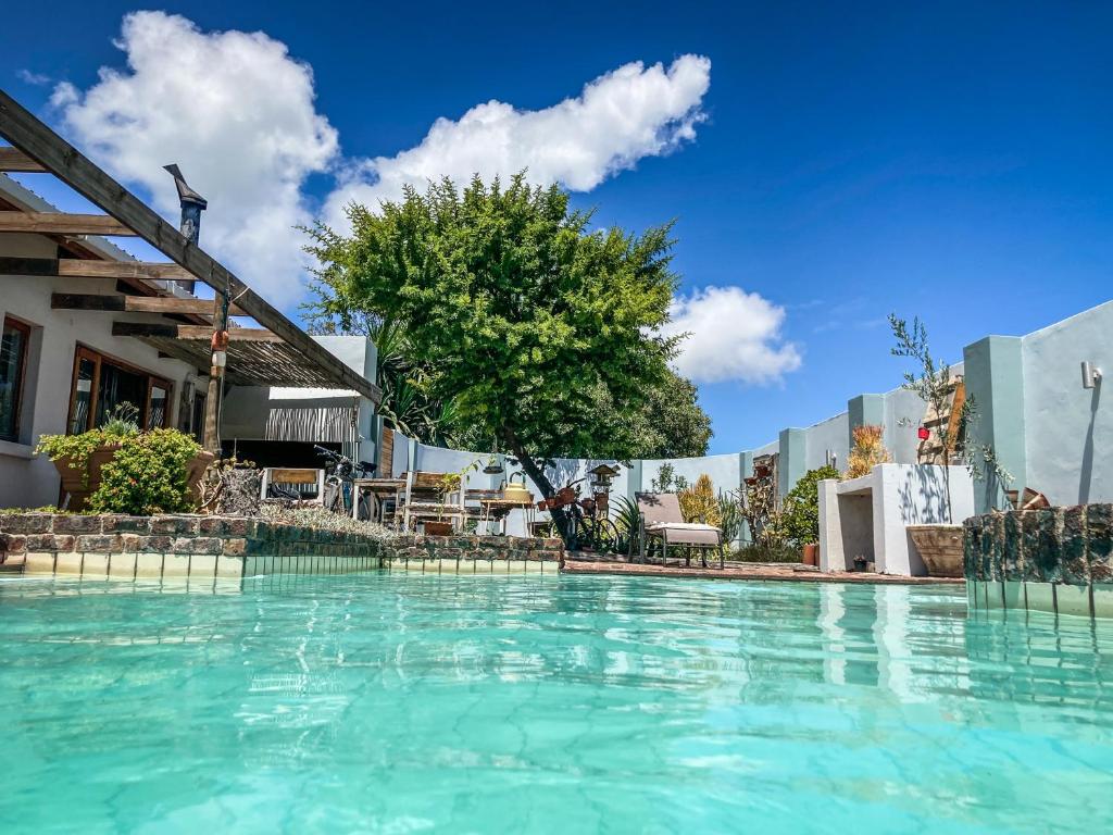 a swimming pool at a hotel with blue water at Langebaan-On-Sea in Langebaan