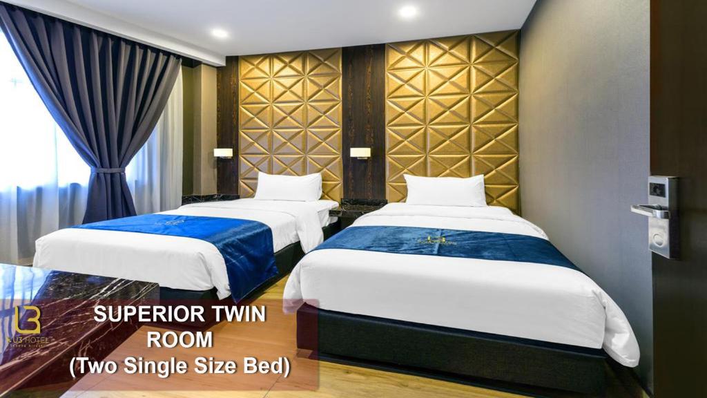 Postel nebo postele na pokoji v ubytování U3 HOTEL