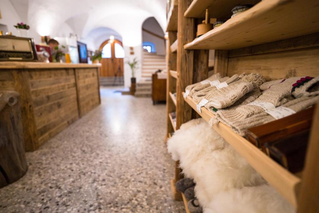 a room with wooden shelves with beds in it at Tourist Farm Šenkova Domačija in Zgornje Jezersko