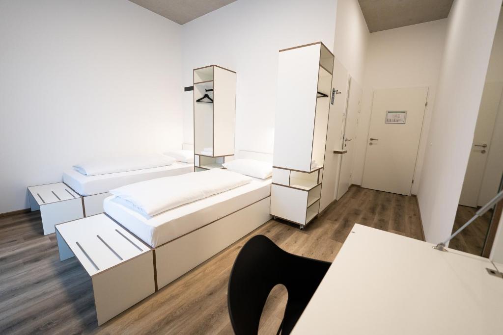 Ein Bett oder Betten in einem Zimmer der Unterkunft Motel Schlafraum Schlüßlberg-Dein smartes Hotel-contactless check-in