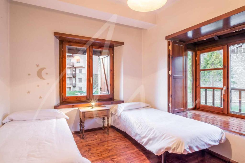 Posteľ alebo postele v izbe v ubytovaní Nin de Beret by SeaMount Rentals