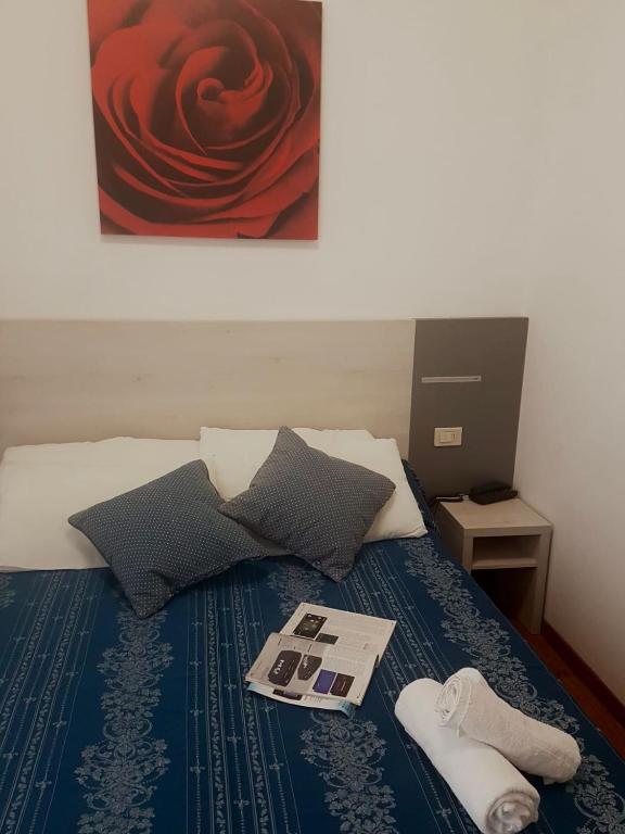 Postel nebo postele na pokoji v ubytování Hotel Arena