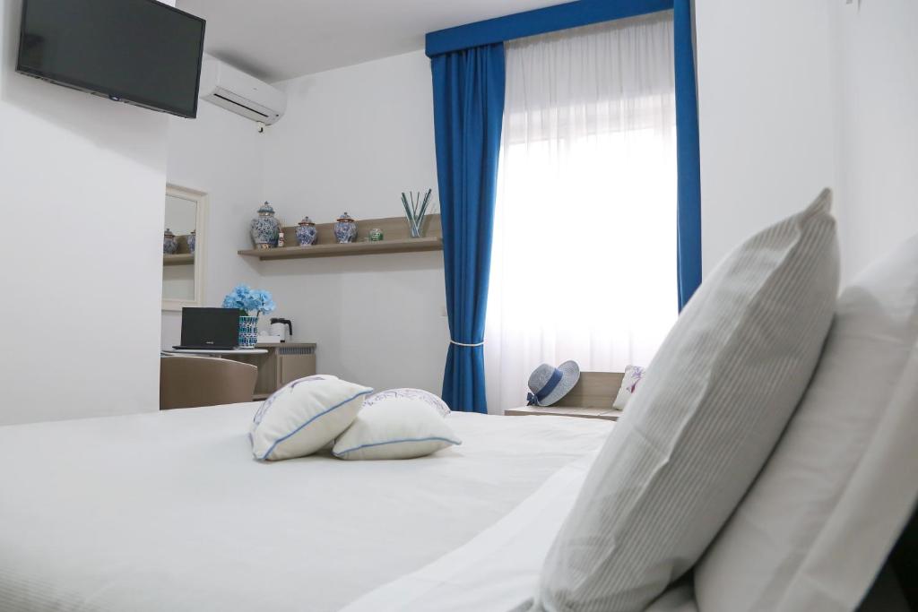 Postel nebo postele na pokoji v ubytování Al Parco II Rota B&B