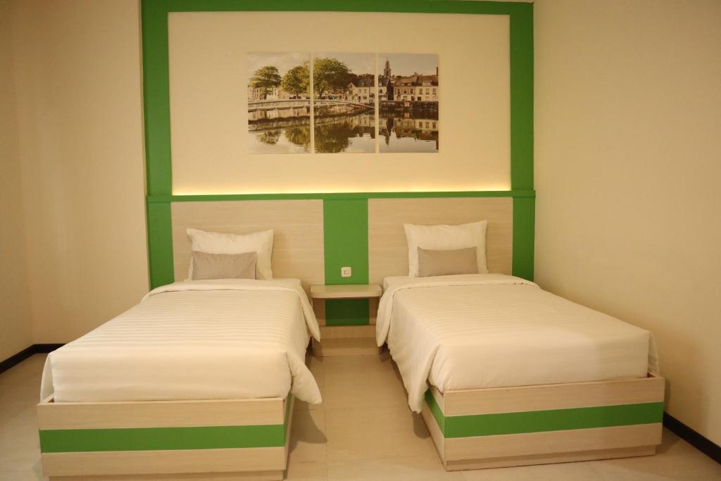 Postel nebo postele na pokoji v ubytování D'Carol Hotel